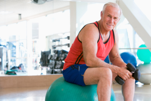 elderly man exercising with weights